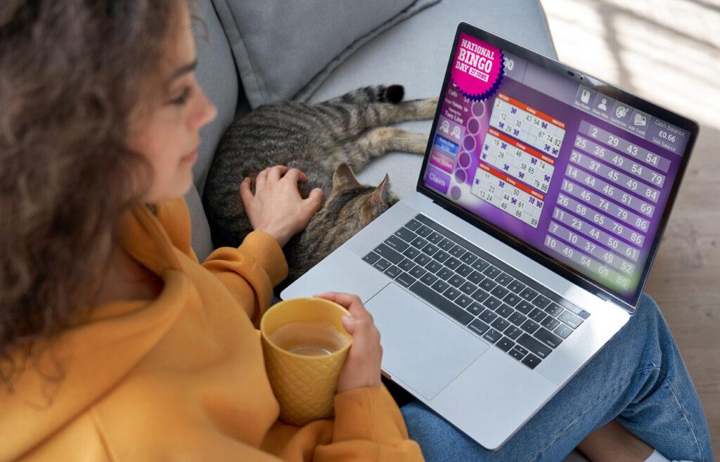 Woman playing bingo on her laptop